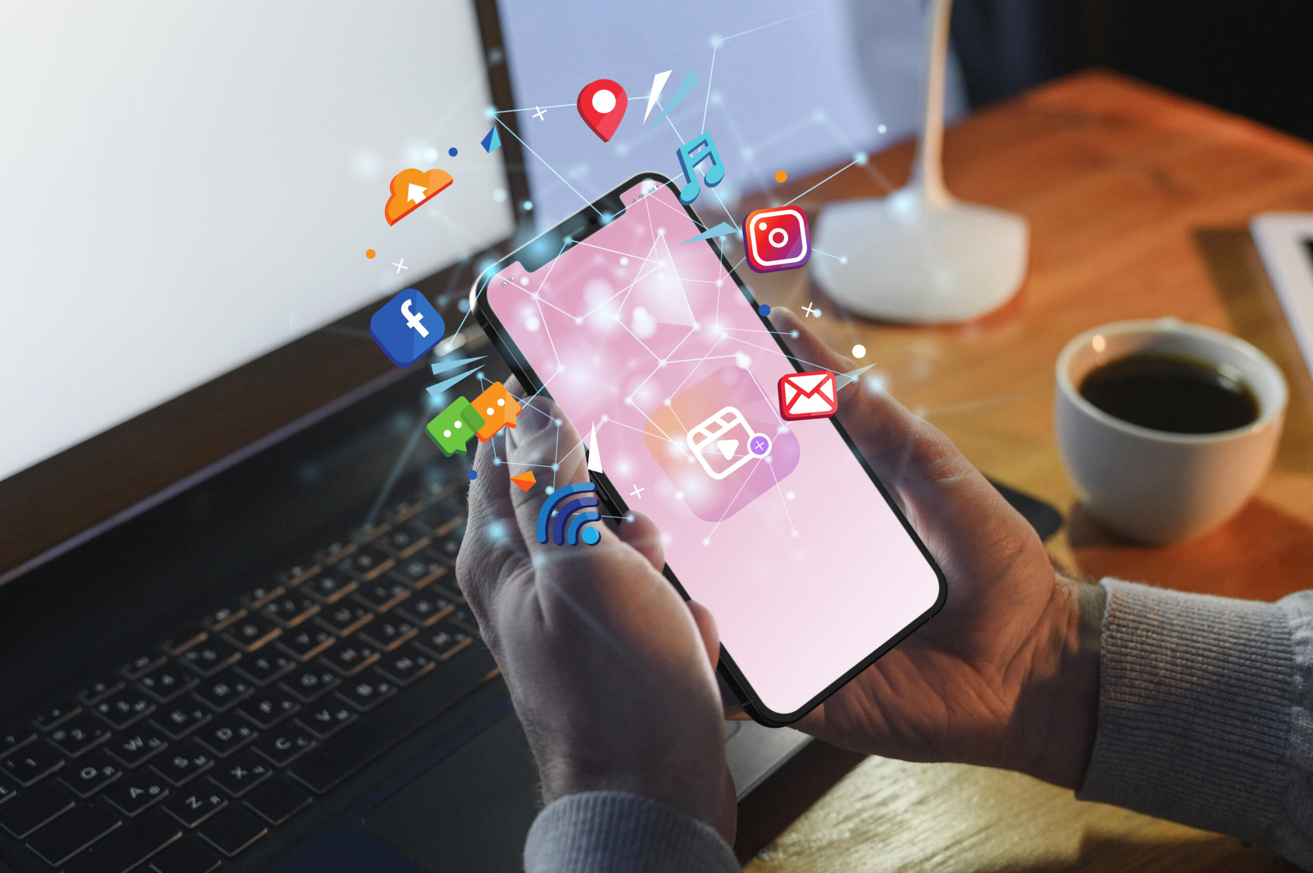 hand holding a smart phone with social media concept